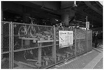 Stacked bicycle parking on the street. Tokyo, Japan ( black and white)