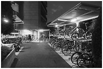 Stacked bicycle storage near residence at night, Yokohama. Japan ( black and white)