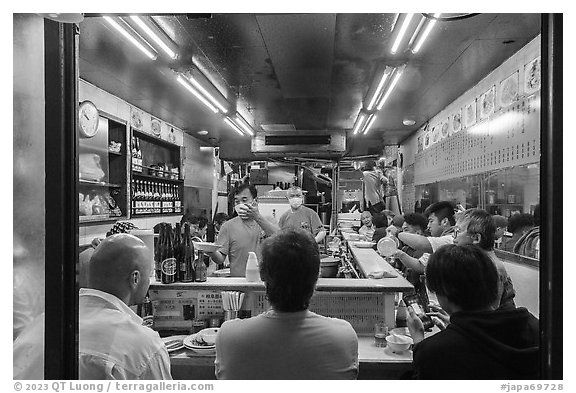 Dinners in small restaurant, Shinjuku. Tokyo, Japan (black and white)