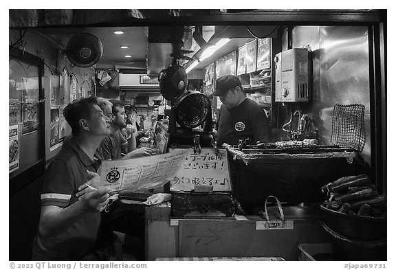 Izakaya food stall, Omoide Yokocho, Shinjuku. Tokyo, Japan (black and white)