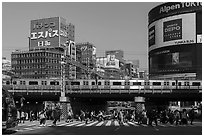 Pedestrian crossing and train, Shinjuku. Tokyo, Japan ( black and white)
