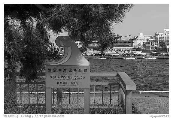 Tsunami sign along the Sakai River. Fujisawa, Japan (black and white)