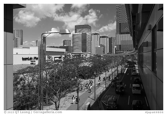 Toyosu street with train and TeamLab building. Tokyo, Japan (black and white)