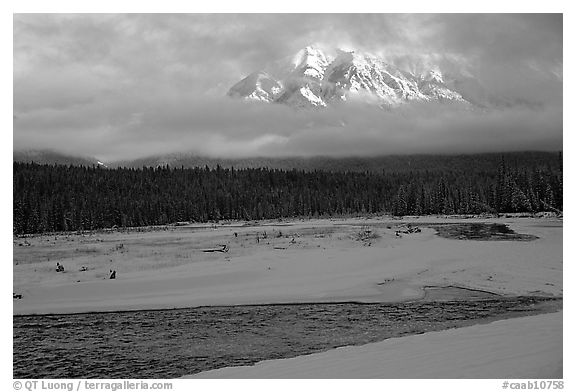 River, snow, and peak emerging from clouds. Banff National Park, Canadian Rockies, Alberta, Canada (black and white)