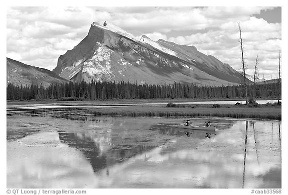 Canoe and Mt Rundle reflection in first Vermillion Lake, afternon. Banff National Park, Canadian Rockies, Alberta, Canada (black and white)