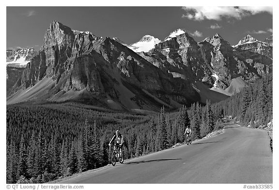 Cyclists on the road to the Valley of Ten Peaks. Banff National Park, Canadian Rockies, Alberta, Canada