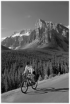 Cyclist on the road to the Valley of Ten Peaks. Banff National Park, Canadian Rockies, Alberta, Canada (black and white)