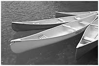 Close up of brightly colored canoes, Moraine Lake. Banff National Park, Canadian Rockies, Alberta, Canada (black and white)