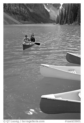 Colorful canoes and conoeists on Moraine Lake. Banff National Park, Canadian Rockies, Alberta, Canada