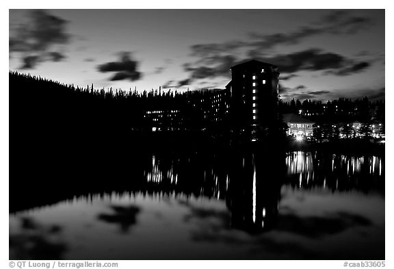 Chateau Lake Louise Hotel reflected in Lake at night. Banff National Park, Canadian Rockies, Alberta, Canada (black and white)
