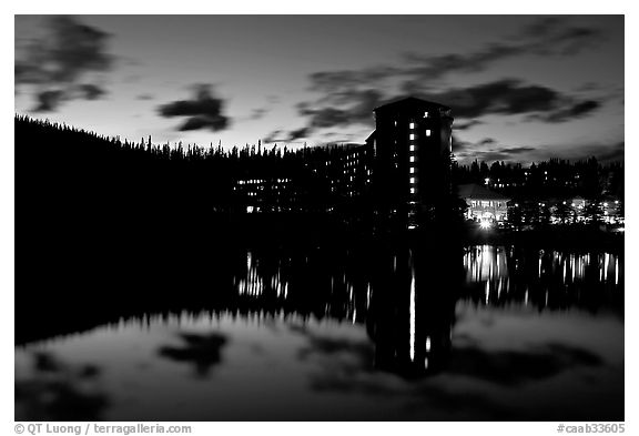 Chateau Lake Louise Hotel reflected in Lake at night. Banff National Park, Canadian Rockies, Alberta, Canada