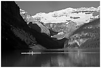 Rower, Lake Louise, and Victoria Peak, early morning. Banff National Park, Canadian Rockies, Alberta, Canada ( black and white)