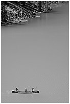 Canoe floatting in Robins egg blue water of Moraine Lake. Banff National Park, Canadian Rockies, Alberta, Canada (black and white)