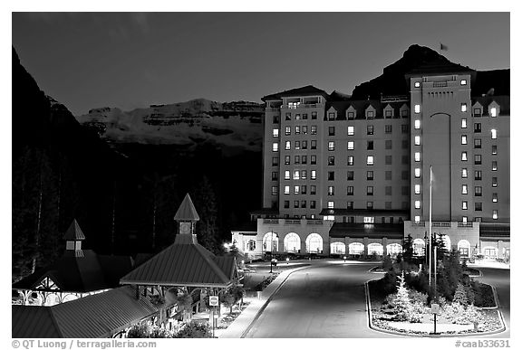 Chateau Lake Louise at night, with Victoria Peak looming behind. Banff National Park, Canadian Rockies, Alberta, Canada (black and white)