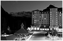 Chateau Lake Louise at night, with Victoria Peak looming behind. Banff National Park, Canadian Rockies, Alberta, Canada (black and white)