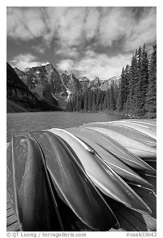 Colorful canoes stacked on the boat dock, Lake Moraine, morning. Banff National Park, Canadian Rockies, Alberta, Canada