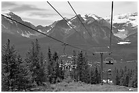 Riding a tram at Lake Louise ski resort. Banff National Park, Canadian Rockies, Alberta, Canada ( black and white)