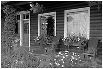 Porch of a cabin with flowers. Banff National Park, Canadian Rockies, Alberta, Canada (black and white)