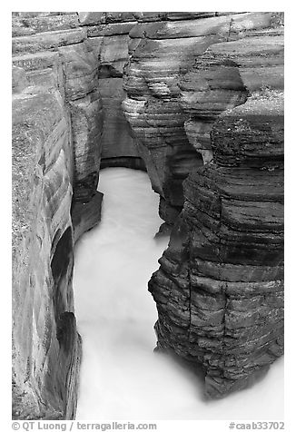 Stratified layers of rock cut by water, Mistaya Canyon. Banff National Park, Canadian Rockies, Alberta, Canada (black and white)