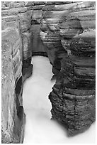 Stratified layers of rock cut by water, Mistaya Canyon. Banff National Park, Canadian Rockies, Alberta, Canada (black and white)