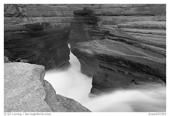 River flowing through narrow rock gorge, Mistaya Canyon. Banff National Park, Canadian Rockies, Alberta, Canada