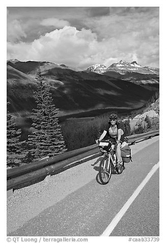 Woman cyclist, Icefieds Parkway. Jasper National Park, Canadian Rockies, Alberta, Canada (black and white)