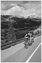 Woman cyclist, Icefieds Parkway. Jasper National Park, Canadian Rockies, Alberta, Canada (black and white)