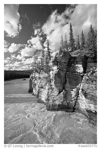 Athabasca River and cliff, late afternoon. Jasper National Park, Canadian Rockies, Alberta, Canada