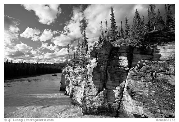 Cliff and Athabasca River, late afternoon. Jasper National Park, Canadian Rockies, Alberta, Canada