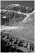 Hikers on trail below the face of Mt Edith Cavell. Jasper National Park, Canadian Rockies, Alberta, Canada ( black and white)