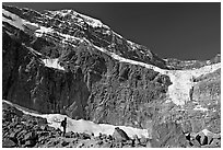 Hiker on a moraine below Mt Edith Cavell and Angel Glacier. Jasper National Park, Canadian Rockies, Alberta, Canada (black and white)