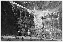 Hikers looking at a hanging glacier on  Mt Edith Cavell. Jasper National Park, Canadian Rockies, Alberta, Canada ( black and white)