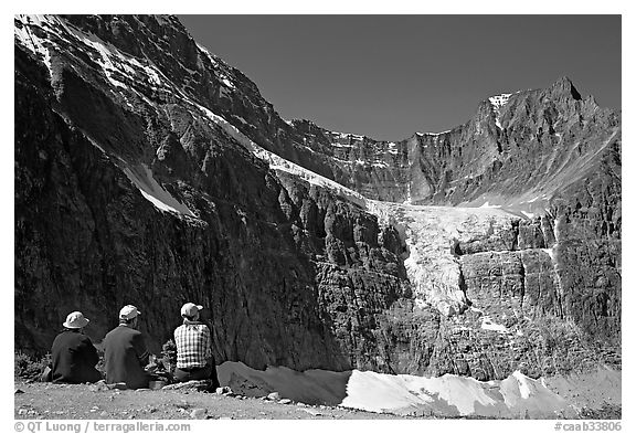 Hikers looking at Angel Glacier and Cavell Glacier. Jasper National Park, Canadian Rockies, Alberta, Canada (black and white)