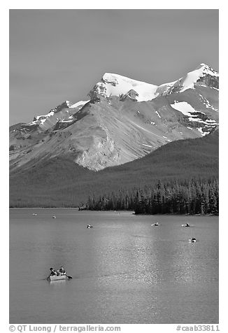 Red canoe on Maligne Lake, afternoon. Jasper National Park, Canadian Rockies, Alberta, Canada