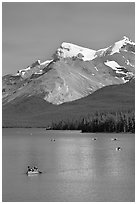 Red canoe on Maligne Lake, afternoon. Jasper National Park, Canadian Rockies, Alberta, Canada (black and white)