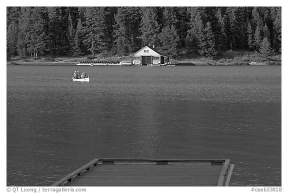 Dock, canoe, and boathouse, Maligne Lake. Jasper National Park, Canadian Rockies, Alberta, Canada (black and white)