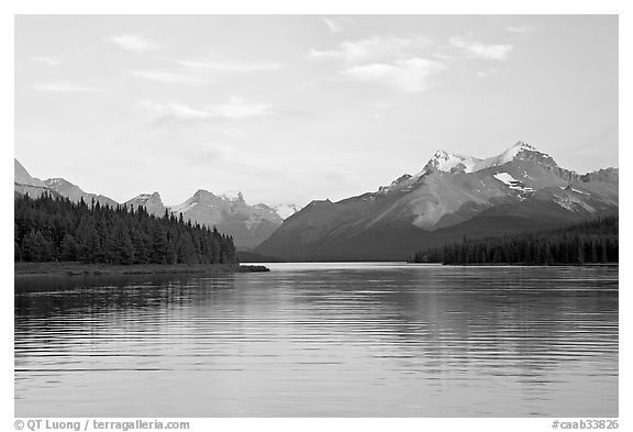 Serene view of Maligne Lake and peaks, sunset. Jasper National Park, Canadian Rockies, Alberta, Canada