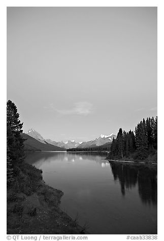 Maligne Lake from the outlet of the Maligne River, blue dusk. Jasper National Park, Canadian Rockies, Alberta, Canada (black and white)