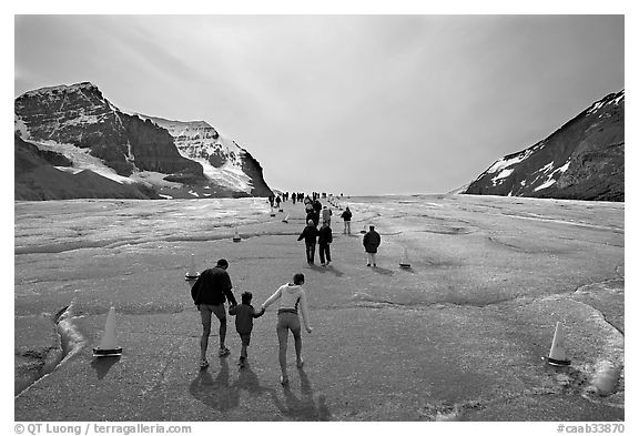 Tourists on Athabasca Glacier, Columbia Icefield. Jasper National Park, Canadian Rockies, Alberta, Canada (black and white)