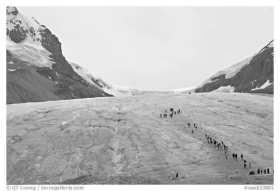 Toe of Athabasca Glacier with tourists in delimited area. Jasper National Park, Canadian Rockies, Alberta, Canada
