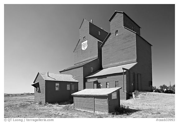 Red wooden grain elevator building. Alberta, Canada (black and white)