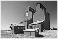Red wooden grain elevator building. Alberta, Canada (black and white)