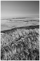 Prairie and teepees from the top of the cliff, Head-Smashed-In Buffalo Jump. Alberta, Canada (black and white)