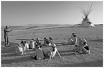 First nations man giving a lecture to students, Head-Smashed-In Buffalo Jump. Alberta, Canada ( black and white)