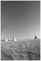 Teepee tents and prairie, late afternoon, Head-Smashed-In Buffalo Jump. Alberta, Canada (black and white)