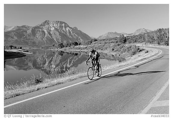 Cyclist next to Lower Waterton Lake. Waterton Lakes National Park, Alberta, Canada (black and white)
