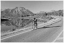 Cyclist next to Lower Waterton Lake. Waterton Lakes National Park, Alberta, Canada ( black and white)