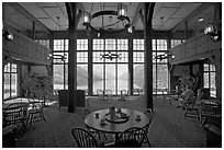 Table with view in lobby of Prince of Wales hotel. Waterton Lakes National Park, Alberta, Canada (black and white)