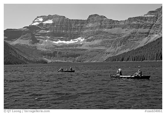 Canoists on Cameron Lake. Waterton Lakes National Park, Alberta, Canada