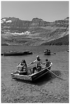 Families boating in Cameron Lake. Waterton Lakes National Park, Alberta, Canada ( black and white)